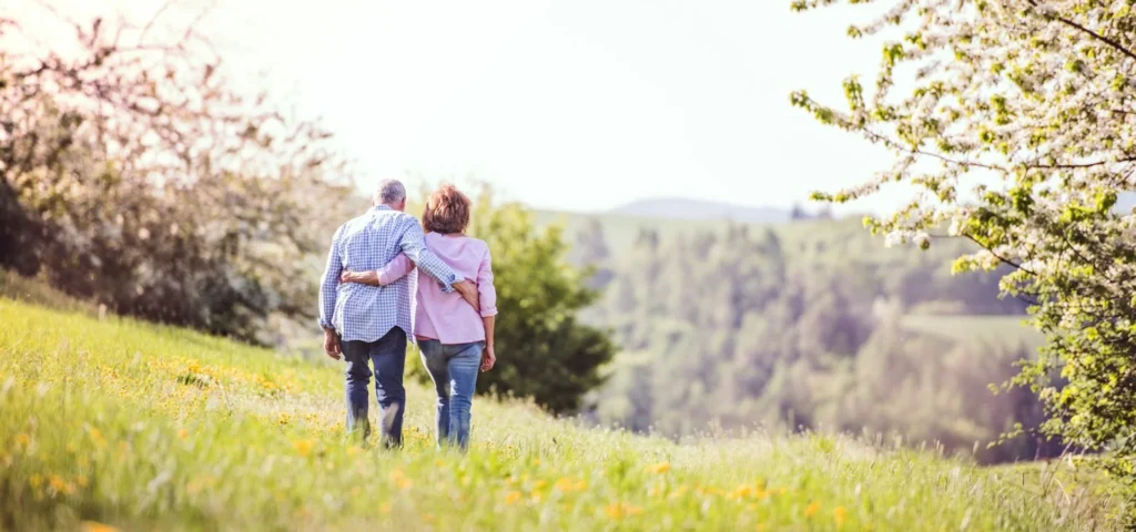 Couple walking in a field